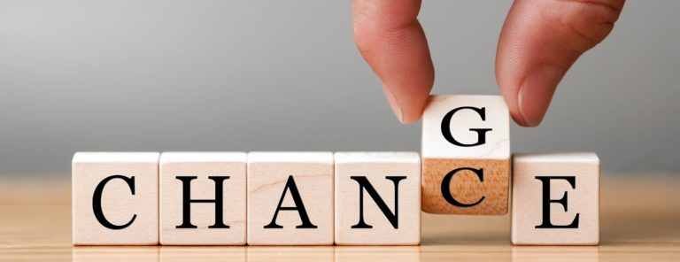 Hand flip wooden cube with word "change" to "chance", Personal development and career growth or change yourself concept